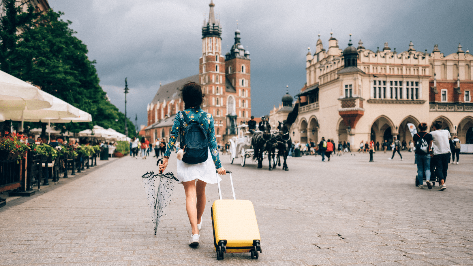 A female solo traveller with light luggage walking on the street