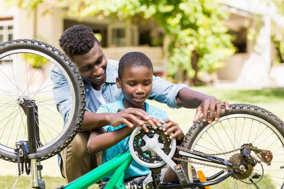 Father and son fixing bike 2-min