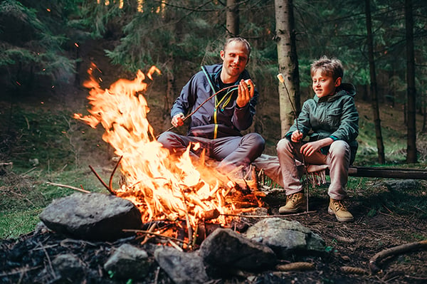 lighting a fire at camp