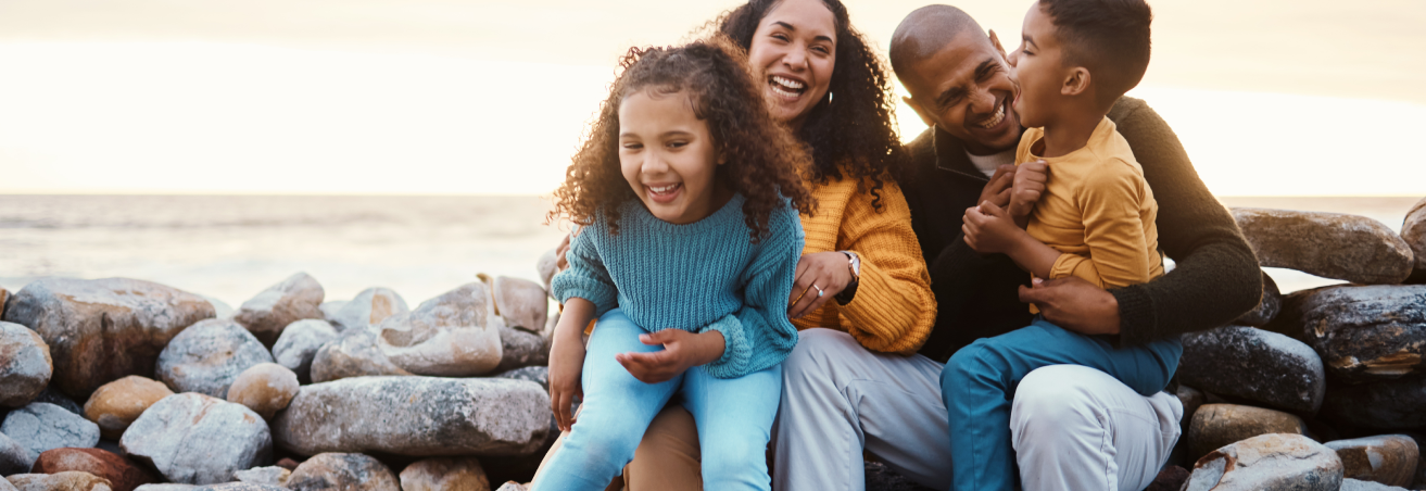 Parents with children having fun at the beach